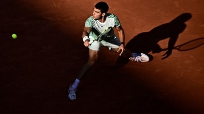 Spain's Carlos Alcaraz Garfia plays a backhand return to Italy's Lorenzo Musetti (AFP) Spain's Carlos Alcaraz Garfia plays a backhand return to Italy's Lorenzo Musetti (AFP)