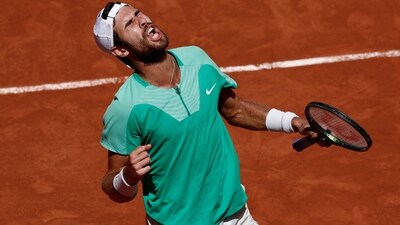 Russia's Karen Khachanov celebrates winning his fourth round match against Italy's Lorenzo Sonego (REUTERS)
