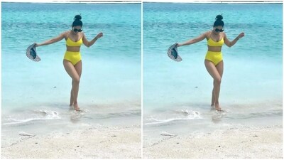 In a neon yellow bralette with metallic slip details and matching lowers, Rakul Preet posed with a monochrome hat. (Instagram/@rakulpreet) In a neon yellow bralette with metallic slip details and matching lowers, Rakul Preet posed with a monochrome hat. (Instagram/@rakulpreet)