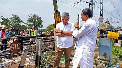 Railways Minister Ashwini Vaishnaw with Union Minister Dharmendra Pradhan at the site of the accident near Bahanaga Bazar railway station in Balasore district. (PTI) Railways Minister Ashwini Vaishnaw with Union Minister Dharmendra Pradhan at the site of the accident near Bahanaga Bazar railway station in Balasore district. (PTI)