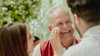 Parineeti Chopra wiping her father's tears during her engagement. Parineeti Chopra wiping her father's tears during her engagement.