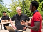 Apple chief executive officer Tim Cook interacts with students ahead of WWDC 2023. 