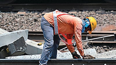 A worker inspects the newly restored track, in Odisha’s Balasore district on Monday. (AFP) A worker inspects the newly restored track, in Odisha’s Balasore district on Monday. (AFP)
