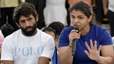 Wrestlers Sakshi Malik and Bajrang Punia address a press conference during their ongoing protest against the alleged sexual harassment of women wrestlers by Wrestling Federation of India (WFI) chief Brij Bhushan Sharan Singh, in New Delhi. (PTI file) Wrestlers Sakshi Malik and Bajrang Punia address a press conference during their ongoing protest against the alleged sexual harassment of women wrestlers by Wrestling Federation of India (WFI) chief Brij Bhushan Sharan Singh, in New Delhi. (PTI file)