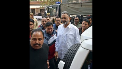 Gangster-turned-politician Mukhtar Ansari is being produced in a district court in a money laundering case, in Prayagraj on Wednesday. (ANI)