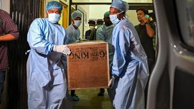 Hospital staff carry a victim's coffin who died in the Odisha train accident. (AFP) Hospital staff carry a victim's coffin who died in the Odisha train accident. (AFP)