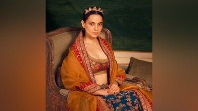 Kangana's multi-coloured lehenga set features a short choli, a lehenga skirt and a dupatta adorned in an intricate floral pattern, gold thread work, shimmering embellishments and gota patti embroidery. While the blouse features a plunge neck, midriff-baring hem length, and half sleeves, the skirt comes with a pleated layered ghera and tassel-adorned waist tie on the side. (Instagram) Kangana's multi-coloured lehenga set features a short choli, a lehenga skirt and a dupatta adorned in an intricate floral pattern, gold thread work, shimmering embellishments and gota patti embroidery. While the blouse features a plunge neck, midriff-baring hem length, and half sleeves, the skirt comes with a pleated layered ghera and tassel-adorned waist tie on the side. (Instagram)