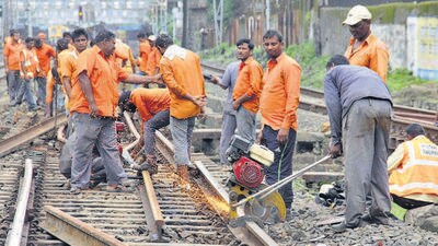 Mumbai, India – August 12, 2018: Railway Gangman work on a track during the mega block between Churchgate to Mumbai Central, in Mumbai, India, on Sunday, Aug 12, 2018. (Photo by Bhushan Koyande/HT) (HT PHOTO)
