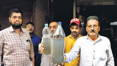 Mumbai, India - June 05, 2023: Residents of Wadi Manzil show the 'stinky and dirty' drinking water they receive, at 96/102, Ghoghari Mohalla, Pydhonie, in Mumbai, India, on Monday, June 05, 2023. (Photo by Bhushan Koyande/HT Photo) (HT PHOTO) Mumbai, India - June 05, 2023: Residents of Wadi Manzil show the 'stinky and dirty' drinking water they receive, at 96/102, Ghoghari Mohalla, Pydhonie, in Mumbai, India, on Monday, June 05, 2023. (Photo by Bhushan Koyande/HT Photo) (HT PHOTO)