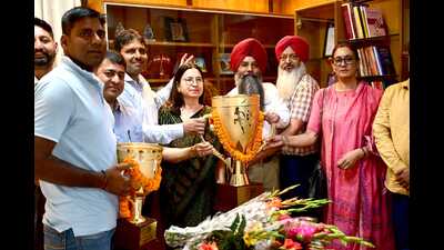 The coaches and managers of the victorious Panjab University contingent meeting vice-chancellor Renu Vig at her office on the campus on Monday. (HT Photo) The coaches and managers of the victorious Panjab University contingent meeting vice-chancellor Renu Vig at her office on the campus on Monday. (HT Photo)