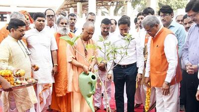 Uttar Pradesh chief minister Yogi Adityanath waters sapling on the premises of Gorakhnath temple in Gorakhpur on Monday. (ANI PHOTO) Uttar Pradesh chief minister Yogi Adityanath waters sapling on the premises of Gorakhnath temple in Gorakhpur on Monday. (ANI PHOTO)