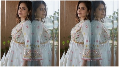 With the assistance of fashion stylist Nidhi Jeswani, Nushrratt embraced a minimalistic approach to accessories. She chose to adorn herself with golden drop statement earrings, gracefully cascading down to touch her shoulders. (Instagram/@nushrrattbharuccha) With the assistance of fashion stylist Nidhi Jeswani, Nushrratt embraced a minimalistic approach to accessories. She chose to adorn herself with golden drop statement earrings, gracefully cascading down to touch her shoulders. (Instagram/@nushrrattbharuccha)