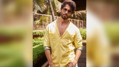 To complete his look, Shahid accessorised with a silver long chain necklace, donned a pair of round-shaped brown sunglasses, and opted for a trendy messy hairstyle. (Instagram/@shahidkapoor ) To complete his look, Shahid accessorised with a silver long chain necklace, donned a pair of round-shaped brown sunglasses, and opted for a trendy messy hairstyle. (Instagram/@shahidkapoor )