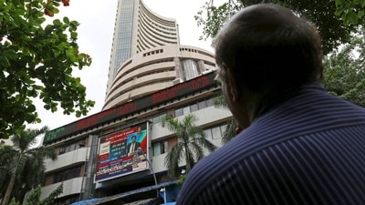 A man looks at a screen across a road displaying the Sensex on the facade of the Bombay Stock Exchange (BSE) building in Mumbai, India. (File image) (REUTERS)