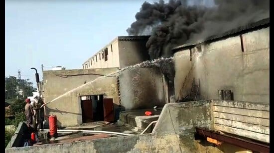 Firefighters trying to control fire at the industrial unit on Chandigarh road in Ludhiana on Monday. (HT Photo)