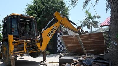 An unauthorised farmhouse is demolished on the Yamuna flooodplains in Sector 135 in Noida in Gautam Budh Nagar on Tuesday. (Sunil Ghosh/HT Photo) An unauthorised farmhouse is demolished on the Yamuna flooodplains in Sector 135 in Noida in Gautam Budh Nagar on Tuesday. (Sunil Ghosh/HT Photo)