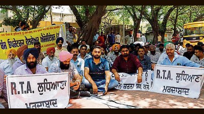 Members of transport associations protesting outside RTA office in Ludhiana on Tuesday. (Manish/HT) Members of transport associations protesting outside RTA office in Ludhiana on Tuesday. (Manish/HT)