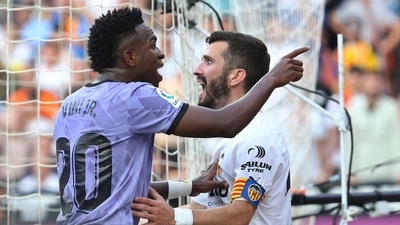 Real Madrid's Vinicius Junior, left, confronts Valencia fans as Valencia's Jose Luis Gaya reacts during a Spanish La Liga match (AP) Real Madrid's Vinicius Junior, left, confronts Valencia fans as Valencia's Jose Luis Gaya reacts during a Spanish La Liga match (AP)