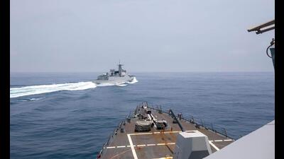 This handout photo shows the Arleigh Burke-class guided-missile destroyer USS Chung-Hoon observing the Chinese PLA Navy vessel Luyang III (top) while on a transit through the Taiwan Strait with the Royal Canadian Navy's HMCS Montreal. (AFP) This handout photo shows the Arleigh Burke-class guided-missile destroyer USS Chung-Hoon observing the Chinese PLA Navy vessel Luyang III (top) while on a transit through the Taiwan Strait with the Royal Canadian Navy's HMCS Montreal. (AFP)