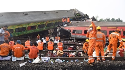 NDRF personnel during a rescue operation after three trains collided with each other resulting in a major accident at Bahanaga railway station of Balasore district in Odisha on Saturday. (Photo by Arabinda Mahapatra) NDRF personnel during a rescue operation after three trains collided with each other resulting in a major accident at Bahanaga railway station of Balasore district in Odisha on Saturday. (Photo by Arabinda Mahapatra)