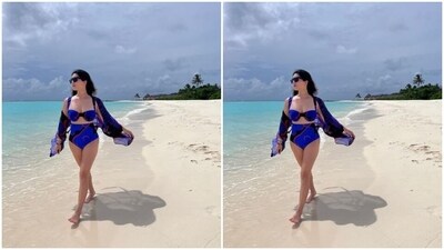 Sunny looked stunning as ever in the black and blue bralette with a sweetheart neckline, and borders in shades of red. She teamed it with a pair of high-waisted matching lowers and a silk shrug. (Instagram/@sunnyleone) Sunny looked stunning as ever in the black and blue bralette with a sweetheart neckline, and borders in shades of red. She teamed it with a pair of high-waisted matching lowers and a silk shrug. (Instagram/@sunnyleone)