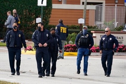 Federal Bureau of Investigation officers (AP) Federal Bureau of Investigation officers (AP)