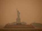 The Statue of Liberty is covered in haze and smoke caused by wildfires in Canada, in New York, US, June 6.