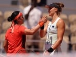 Brazil's Beatriz Haddad Maia (R) shakes hands with Tunisia's Ons Jabeur after her victory during their women's singles quarter final match on day eleven of the Roland-Garros Open