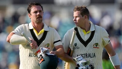 Australia's Travis Head, left and teammate Australia's Steven Smith walk off the pitch together after the end of play on the first day of the ICC World Test Championship Final between India and Australia at The Oval cricket ground in London, Wednesday, June 7, 2023. (AP Photo/Kirsty Wigglesworth) (AP) Australia's Travis Head, left and teammate Australia's Steven Smith walk off the pitch together after the end of play on the first day of the ICC World Test Championship Final between India and Australia at The Oval cricket ground in London, Wednesday, June 7, 2023. (AP Photo/Kirsty Wigglesworth) (AP)