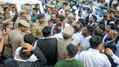 Police personnel and lawyers outside the court premises in Lucknow after the murder of gangster Sanjeev Maheshwari alias Jeeva on Wednesday. (ANI PHOTO) Police personnel and lawyers outside the court premises in Lucknow after the murder of gangster Sanjeev Maheshwari alias Jeeva on Wednesday. (ANI PHOTO)