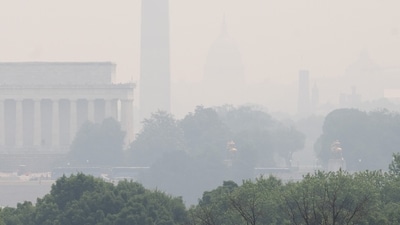 A haze is seen over the Lincoln Memorial and Washington Monument on the National Mall as smoke from wildfires in Canada cause hazy conditions in Washington. (AFP)