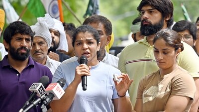 Wrestlers Vinesh Phogat, Sakshi Malik and Bajrang Punia speak with the media during their protest against Wrestling Federation of India (WFI) chief Brij Bhushan Sharan Singh. (File Photo by Sanjeev Verma/ Hindustan Times) Wrestlers Vinesh Phogat, Sakshi Malik and Bajrang Punia speak with the media during their protest against Wrestling Federation of India (WFI) chief Brij Bhushan Sharan Singh. (File Photo by Sanjeev Verma/ Hindustan Times)