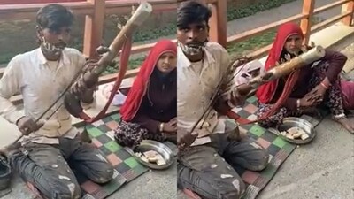 Man playing soothing music on sarangi at a railway station. (Twitter/@BIVALKAR) Man playing soothing music on sarangi at a railway station. (Twitter/@BIVALKAR)
