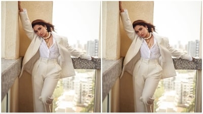Her outfit consists of a crisp white shirt, paired with an oversized beige blazer that exudes sophistication. Completing the ensemble are high-waisted beige pants, adding a touch of elegance and flair. (Instagram/@tamannaahspeaks) Her outfit consists of a crisp white shirt, paired with an oversized beige blazer that exudes sophistication. Completing the ensemble are high-waisted beige pants, adding a touch of elegance and flair. (Instagram/@tamannaahspeaks)