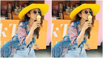 Rakul Preet looked droolworthy in a blue silk top with cut-out details and multicoloured patterns, teamed with a pair of distressed denim shorts. She added a matching shirt to complete her look.&nbsp; (Instagram/@rakulpreet)