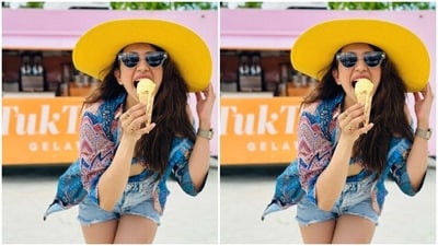 In tinted shades, a contrasting statement beach hat and white flip flops, Rakul Preet aced the look to perfection.&nbsp; (Instagram/@rakulpreet)