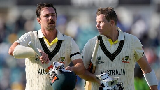 Australia's Travis Head, left and teammate Australia's Steven Smith walk off the pitch together after the end of play on the first day of the ICC World Test Championship Final between India and Australia at The Oval cricket ground in London, Wednesday, June 7, 2023. (AP Photo/Kirsty Wigglesworth)(AP)