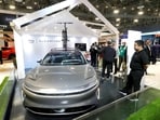 A Lucid Air electric car with built-in Alexa is displayed in an Amazon booth during CES 2023, an annual consumer electronics trade show, in Las Vegas, 