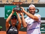 Japan's Miyu Kato, left, and Germany's Tim Puetz hold the trophy after winning the mixed doubles final match of the French Open. Japan's Miyu Kato, left, and Germany's Tim Puetz hold the trophy after winning the mixed doubles final match of the French Open.
