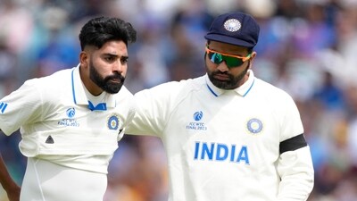 Rohit Sharma (R) with Mohammed Siraj (AP) Rohit Sharma (R) with Mohammed Siraj (AP)