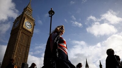 UK Heatwave: People walk in front of the Elizabeth Tower, more commonly known as Big Ben in London, Britain. (Reuters)