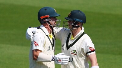 Australia's Travis Head celebrates reaching his 150 with Steve Smith. (Action Images via Reuters)