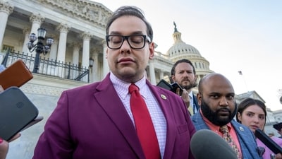 FILE - Rep. George Santos, R-N.Y., speaks to reporters outside the Capitol, as his top political aide Vish Burra, second from right, listens, after an effort to expel Santos from the House, in Washington, Wednesday, May 17, 2023. A man who briefly worked as an aide to Santos told House investigators Wednesday, May 31, that he got his job after sending a series of payments to Burra, Santos' director of operations. (AP)