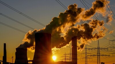 Steam rises from the coal-fired power plant near wind turbines Niederaussem, Germany, as the sun rises on Wednesday, Nov. 2, 2022. Germany cut its greenhouse gas emissions by almost 2% last year, beating previous estimates but still falling far short of the cuts needed to meet its medium-term climate goals. (AP Photo) Steam rises from the coal-fired power plant near wind turbines Niederaussem, Germany, as the sun rises on Wednesday, Nov. 2, 2022. Germany cut its greenhouse gas emissions by almost 2% last year, beating previous estimates but still falling far short of the cuts needed to meet its medium-term climate goals. (AP Photo)