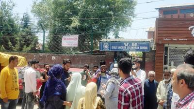 Family members of students protest for allegedly not allowing students to enter the school premises wearing 'Abaya', in Srinagar. (ANI) Family members of students protest for allegedly not allowing students to enter the school premises wearing 'Abaya', in Srinagar. (ANI)