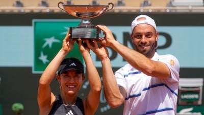 Japan's Miyu Kato, left, and Germany's Tim Puetz hold the trophy after winning the mixed doubles final match of the French Open. (AP) Japan's Miyu Kato, left, and Germany's Tim Puetz hold the trophy after winning the mixed doubles final match of the French Open. (AP)