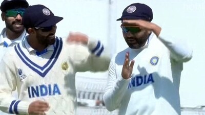 Rohit Sharma doesn't complete his DRS signal. Rohit Sharma doesn't complete his DRS signal.