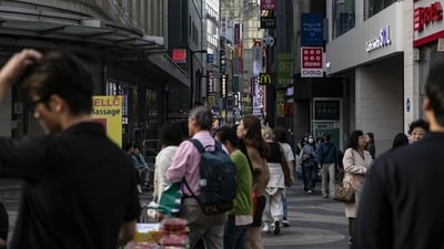 Pedestrians at the famous Myeongdong shopping district in Seoul. The South Korean capital city is also among the top ten in the most expensive places to bear surging cost of living, as the country's inflation is through the roof. Even though the inflation cooled to a 19-month low in May, it was still high. The government Thursday lowered it projection for this year's economic growth from the previous projection of 1.6%. (Bloomberg)