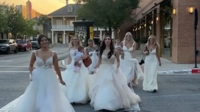 Women in their wedding dresses on their way to dinner. (Instagram/@alexisnhouston) Women in their wedding dresses on their way to dinner. (Instagram/@alexisnhouston)