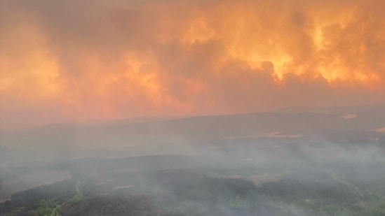 Prime Minister Justin Trudeau said Canada was living through its “worst wildfire season” in recorded history during a briefing with journalists in Ottawa on June 7.(AFP)